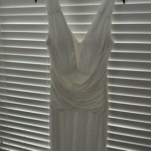 Selling a brand new floor length white, mini sequin dress.